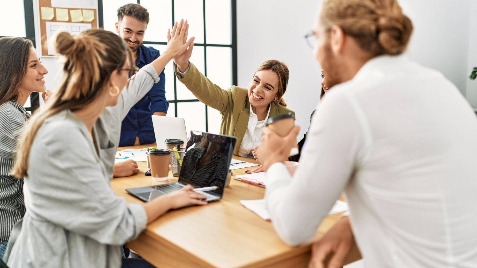 Participants collaborating on SEO strategy workshop using analytics tools